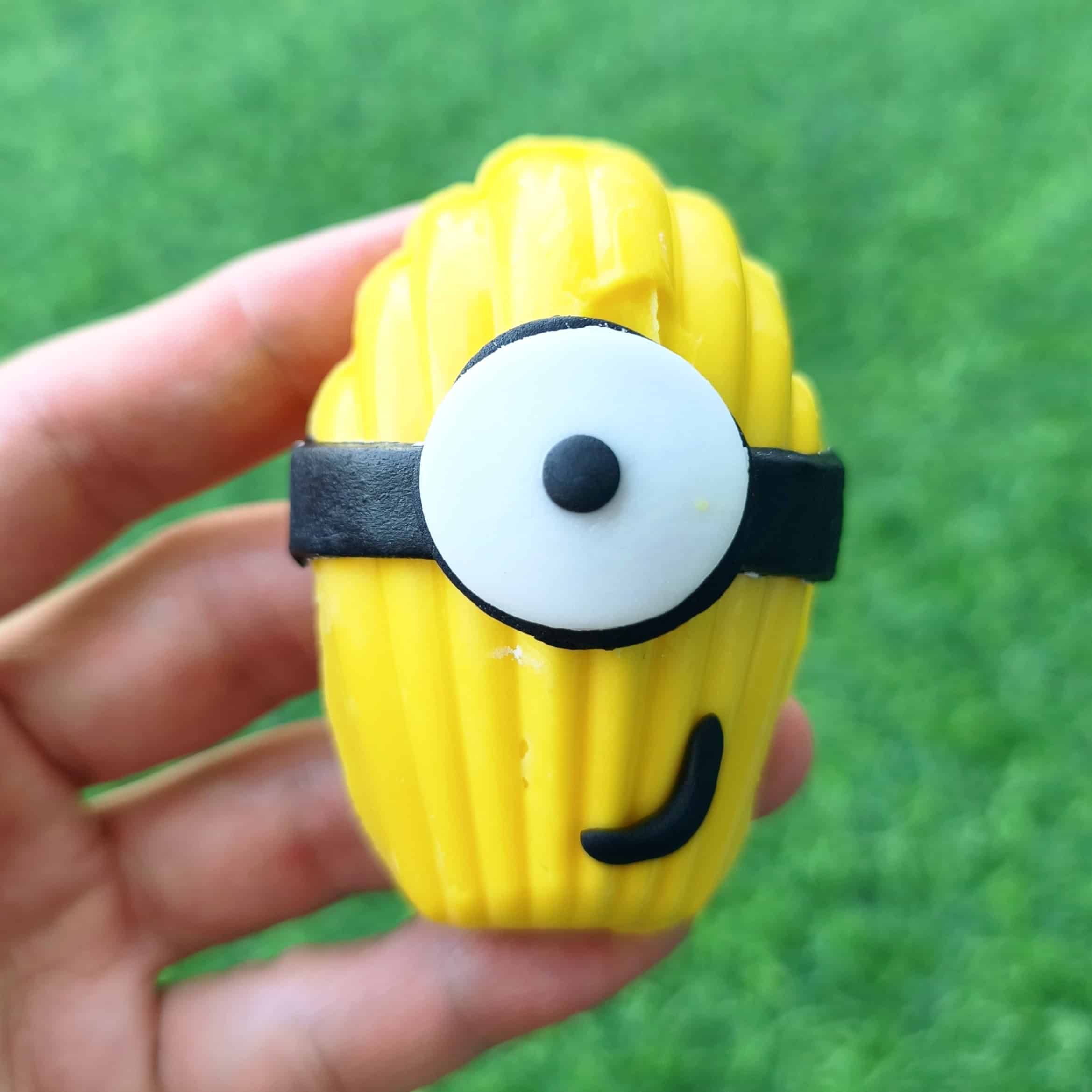 minion madeline resting on a palm